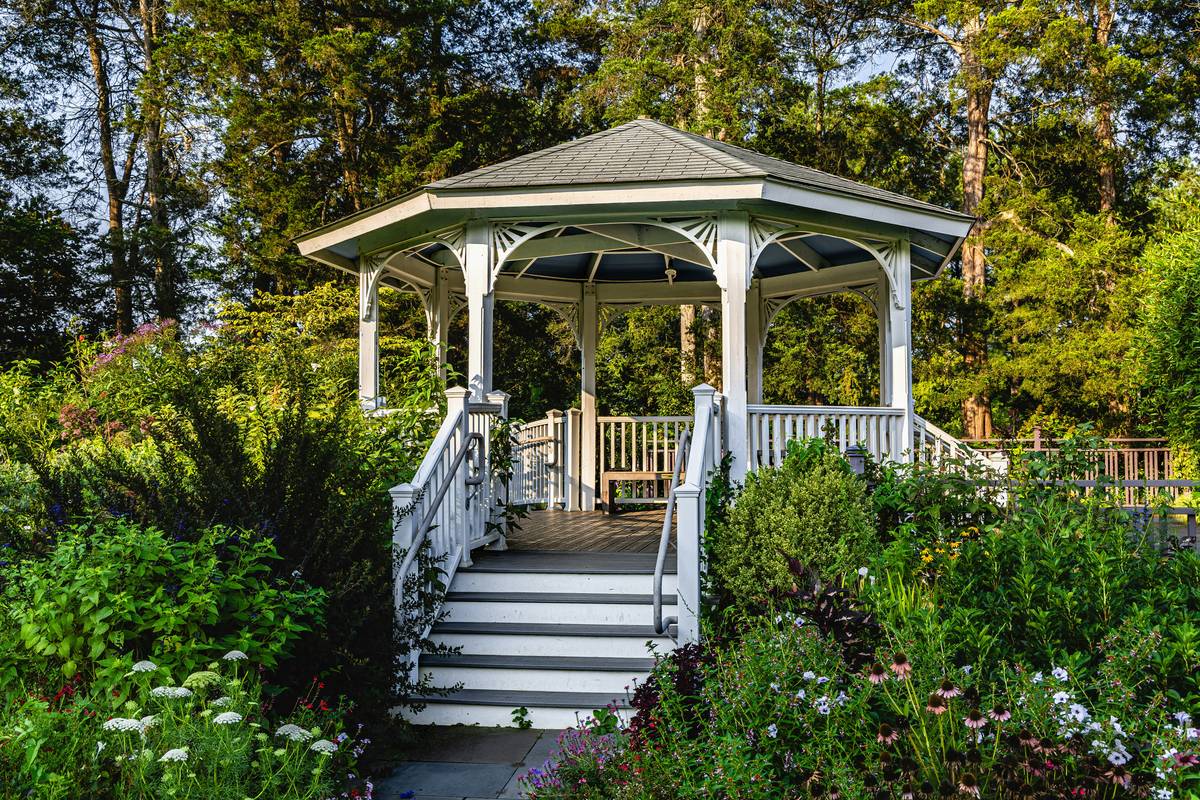 pergola structure arbor a b outdoor showing integrated arbor post framing with open-rafter pergola roof over a backyard patio